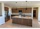 Spacious kitchen featuring granite countertops and modern wood cabinets at 39110 E 146Th Ct, Keenesburg, CO 80643