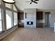 Bright living room with a fireplace and built-in shelving at 39110 E 146Th Ct, Keenesburg, CO 80643