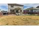 Large backyard with a patio, seating, and well-maintained grass, perfect for outdoor relaxation at 9 N Waterloo St, Aurora, CO 80018