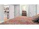 Warm and inviting bedroom, showcasing a comfortable bed and access to a mini kitchenette at 9 N Waterloo St, Aurora, CO 80018