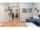 Spacious living room with modern decor, a cozy couch, and an open doorway to a bedroom at 9 N Waterloo St, Aurora, CO 80018