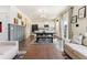 Open-concept living, dining, and kitchen space featuring hardwood floors and ample natural light at 9 N Waterloo St, Aurora, CO 80018