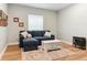 Inviting living room with a cozy couch, stylish coffee table, and modern electric fireplace at 9 N Waterloo St, Aurora, CO 80018