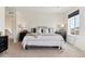 Bright and airy main bedroom featuring plush carpet, a large bed, and natural light at 9 N Waterloo St, Aurora, CO 80018