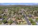 Aerial view of neighborhood with mature trees and manicured lawns in a suburban setting at 805 S Everett St, Lakewood, CO 80226