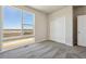 Bedroom featuring a large window with mountain views and a sliding closet at 2277 Serenidad St, Brighton, CO 80601