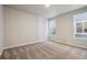 Comfortable bedroom featuring soft carpet and natural light streaming through windows at 2277 Serenidad St, Brighton, CO 80601