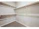 Walk-in closet with built-in shelving offering ample storage space at 2277 Serenidad St, Brighton, CO 80601