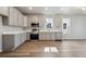 Modern kitchen featuring stainless steel appliances, ample counter space, and stylish cabinets at 2277 Serenidad St, Brighton, CO 80601