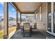 Relaxing back porch area with outdoor seating, a covered roof, and views of the backyard at 5670 Pinto Valley St, Parker, CO 80134