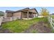 A backyard showcasing a covered patio at 5670 Pinto Valley St, Parker, CO 80134