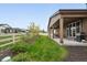 A side yard showcasing a covered patio and fence at 5670 Pinto Valley St, Parker, CO 80134
