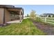 A backyard featuring a covered patio and fence at 5670 Pinto Valley St, Parker, CO 80134