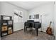 Bedroom featuring a piano, a guitar, and a large window at 5670 Pinto Valley St, Parker, CO 80134