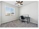 Cozy bedroom with a ceiling fan, a neutral color scheme, and a window view at 5670 Pinto Valley St, Parker, CO 80134