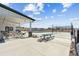 Community pool area with seating, tables, and views of the surrounding neighborhood at 5670 Pinto Valley St, Parker, CO 80134