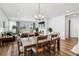Open floor plan featuring dining area, living room with fireplace, and access to the backyard at 5670 Pinto Valley St, Parker, CO 80134