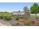 Stone community entrance sign surrounded by greenery and landscaping, creating a welcoming atmosphere at 5670 Pinto Valley St, Parker, CO 80134