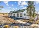 Striking community center with white siding, a green roof, and meticulous landscaping for a modern, inviting space at 5670 Pinto Valley St, Parker, CO 80134