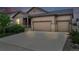 Charming single-Gathering home features a three car garage, stone accents, and well-manicured landscaping at 5670 Pinto Valley St, Parker, CO 80134