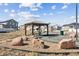 Community gazebo with picnic table in a beautiful, well-maintained common area at 5670 Pinto Valley St, Parker, CO 80134