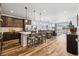 Modern kitchen featuring a large island with a breakfast bar and stainless steel appliances at 5670 Pinto Valley St, Parker, CO 80134