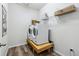 Laundry room with side-by-side washer and dryer, wooden platform, and wire shelving for storage at 5670 Pinto Valley St, Parker, CO 80134