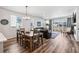 Bright living and dining area with sliding glass doors to backyard and comfortable seating at 5670 Pinto Valley St, Parker, CO 80134