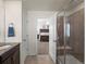 Bathroom with shower, vanity, and view into main bedroom at 3260 Jonquil St, Castle Rock, CO 80109