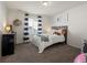 Bright bedroom with a double bed and striped curtains at 3260 Jonquil St, Castle Rock, CO 80109