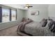 Spacious bedroom with large windows, carpet, and ceiling fan at 3260 Jonquil St, Castle Rock, CO 80109