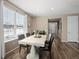 Dining area with white table and four black chairs at 3260 Jonquil St, Castle Rock, CO 80109