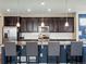 Modern kitchen with dark cabinets and granite countertops at 3260 Jonquil St, Castle Rock, CO 80109