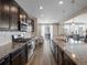 Open concept kitchen with granite countertops and island at 3260 Jonquil St, Castle Rock, CO 80109