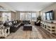 Spacious living room with L-shaped sectional sofa at 3260 Jonquil St, Castle Rock, CO 80109