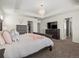 Main bedroom with large bed, dresser, and access to bathroom at 3260 Jonquil St, Castle Rock, CO 80109