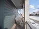 Side porch with white railing and a white chair at 3260 Jonquil St, Castle Rock, CO 80109