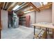 Unfinished basement area with utilities and ample open space at 8563 Redstone St, Highlands Ranch, CO 80126