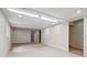 Open basement area featuring carpet and ample lighting at 8563 Redstone St, Highlands Ranch, CO 80126