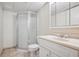 Bathroom featuring a tiled floor, vanity sink, toilet, and shower at 8563 Redstone St, Highlands Ranch, CO 80126
