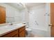 Bright bathroom with a sink, a toilet and a bathtub with white tiles at 8563 Redstone St, Highlands Ranch, CO 80126