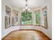 Dining area with hardwood floors, bay window, and chandelier at 8563 Redstone St, Highlands Ranch, CO 80126