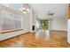 Spacious living room with hardwood floors, a fireplace and large windows offering ample natural light at 8563 Redstone St, Highlands Ranch, CO 80126