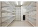 Walk-in pantry with metal shelving for optimal storage at 8563 Redstone St, Highlands Ranch, CO 80126