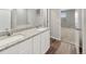 Bathroom featuring double vanity with granite countertop, and view to bedroom at 2134 Alyssa St, Fort Lupton, CO 80621