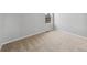 Neutral bedroom with tan carpeting, white trim and walls and a window for ample natural light at 2134 Alyssa St, Fort Lupton, CO 80621