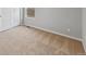 Neutral bedroom with tan carpeting, white trim and walls and a window for ample natural light at 2134 Alyssa St, Fort Lupton, CO 80621