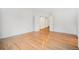 Bright bedroom with hardwood floors, neutral paint, and double doors to hallway at 5607 S Gray St, Littleton, CO 80123