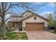 Charming two-story home with a two car garage and a covered front porch at 5607 S Gray St, Littleton, CO 80123