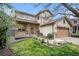 Beautiful two-story home with a well-manicured front yard and covered porch at 5607 S Gray St, Littleton, CO 80123